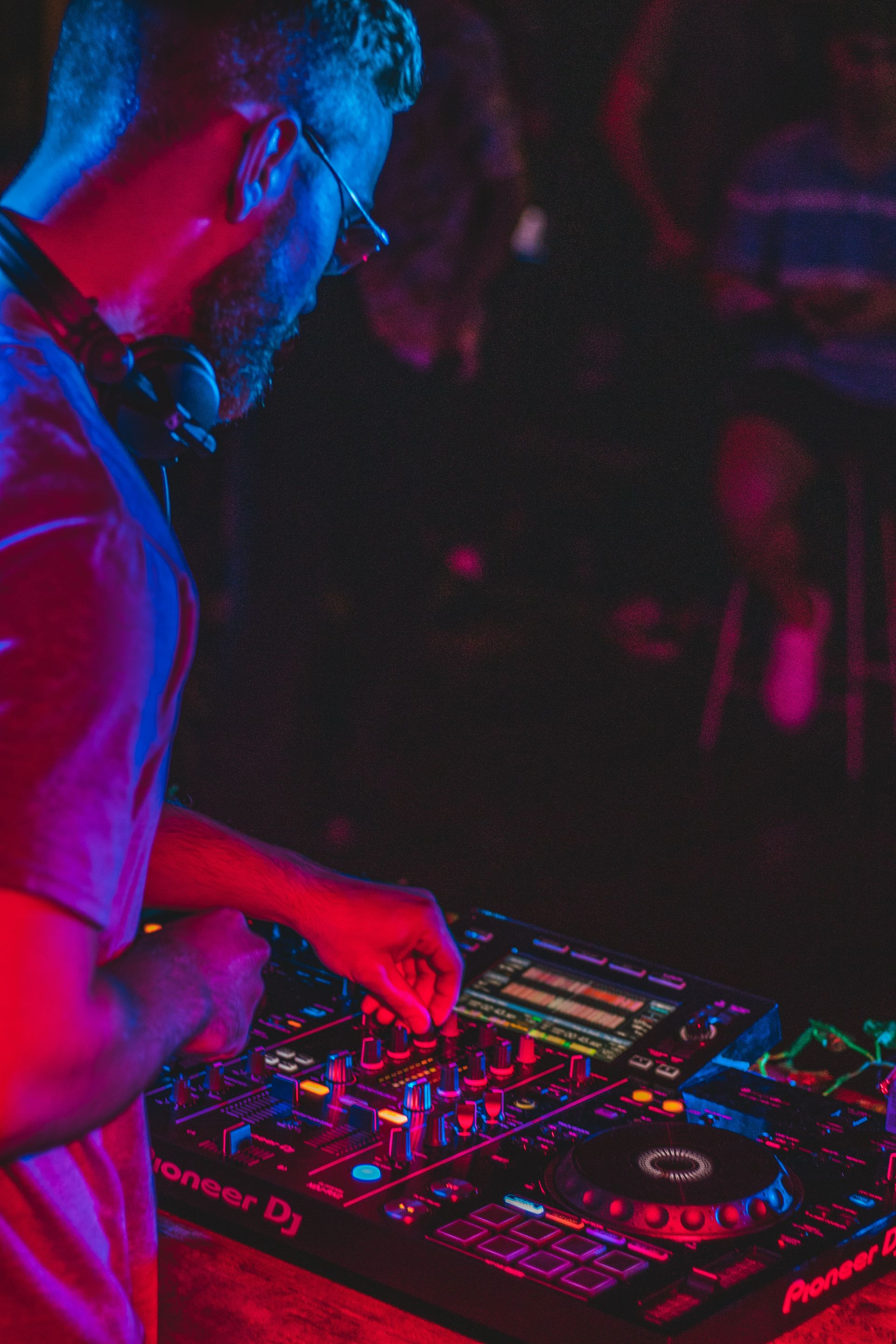 person playing audio mixer in concert